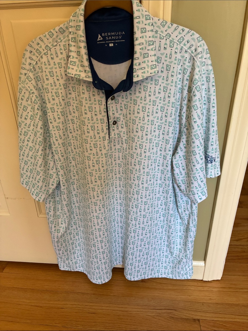 Men’s White Polo with Green Print - Wildhawk golf club on sleeve